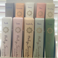 Display of 'Holy Smoke' eco incense sticks with various scents on a white stand.