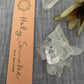 'Flow' Incense Packaged next to dried flower and clear quartz crystals.
