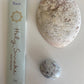 'Peace' Incense Packaged next to a shell and  ruby in kyanite crystal.