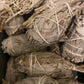 Bundles of Californian White Sage tied together, used for smudging to offer, purify and cleanse spaces or individuals of negative energies.