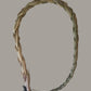 Sweet grass braid on a plain cream background