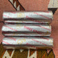 Three Kings rolls in silver packaging on a patterned surface